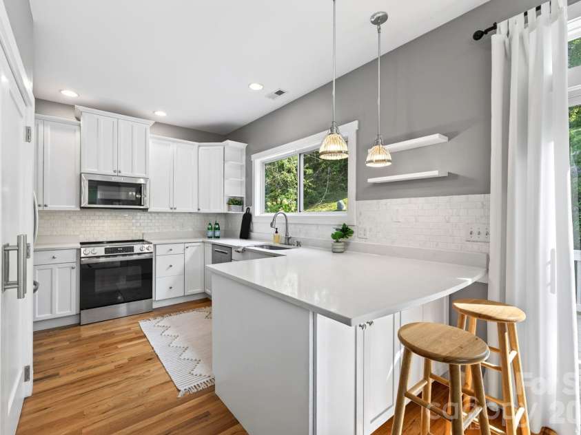 26 Macdougall Lane, Weaverville, NC 28787.  MLS# CAR4421796, YatesRealty ID 49155. Kitchen with Breakfast Bar