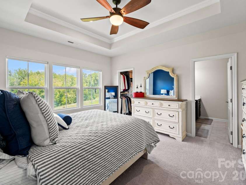 435 Lahinch Drive, Tega Cay, SC 29708.  MLS# CAR4422014, YatesRealty ID 49162. Master Suite Overlooks Private Backyard with Pond!