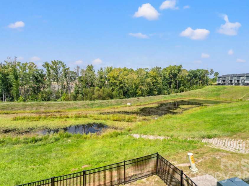 435 Lahinch Drive, Tega Cay, SC 29708.  MLS# CAR4422014, YatesRealty ID 49162. Private Backyard with View of Pond!
