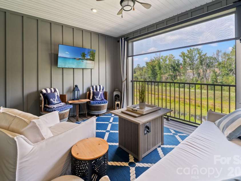 435 Lahinch Drive, Tega Cay, SC 29708.  MLS# CAR4422014, YatesRealty ID 49162. Screened In Porch with Remote Controlled Roller Shade