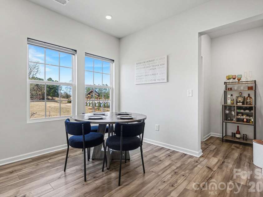 117 Morning Gap Parkway, Fort Mill, SC 29715.  MLS# CAR4333429, YatesRealty ID 4918. Dining area with half bathroom on second floor. 