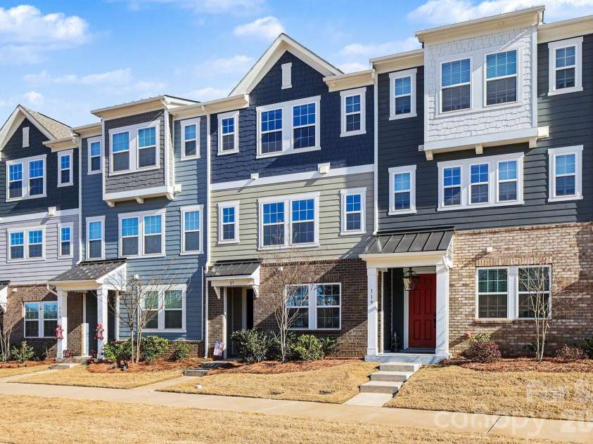 117 Morning Gap Parkway, Fort Mill, SC 29715.  MLS# CAR4333429, YatesRealty ID 4918. Front of town home with sidewalks. 