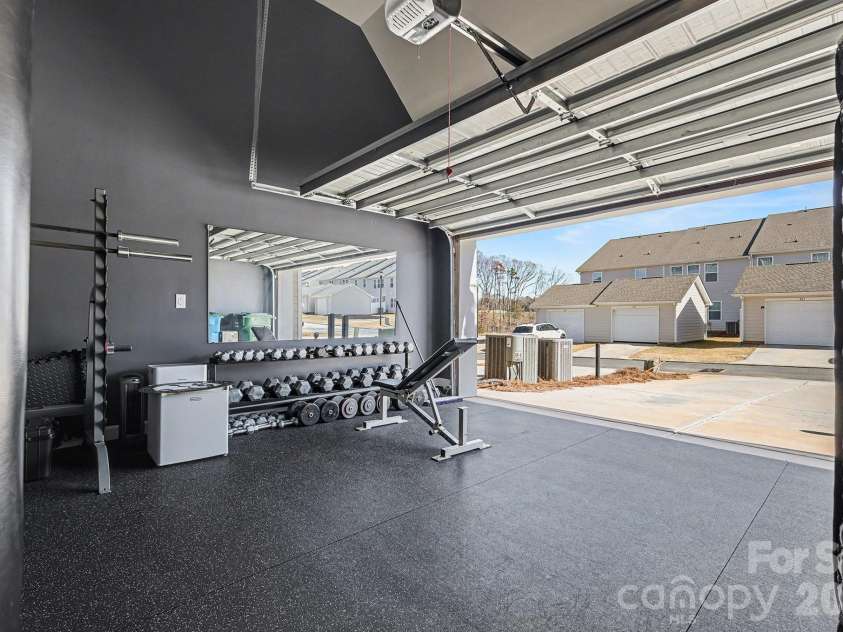 117 Morning Gap Parkway, Fort Mill, SC 29715.  MLS# CAR4333429, YatesRealty ID 4918. Garage that has been converted to a gym is rear facing. Gym rubber flooring 3/4 inch thickness.