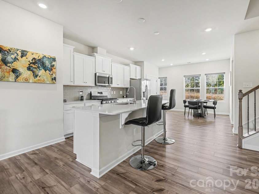 117 Morning Gap Parkway, Fort Mill, SC 29715.  MLS# CAR4333429, YatesRealty ID 4918. Kitchen on second floor with midafternoon light coming in through the windows.