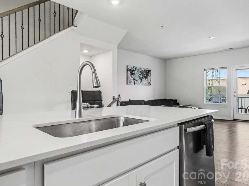 117 Morning Gap Parkway, Fort Mill, SC 29715.  MLS# CAR4333429, YatesRealty ID 4918. Large kitchen sink located on quartz island.