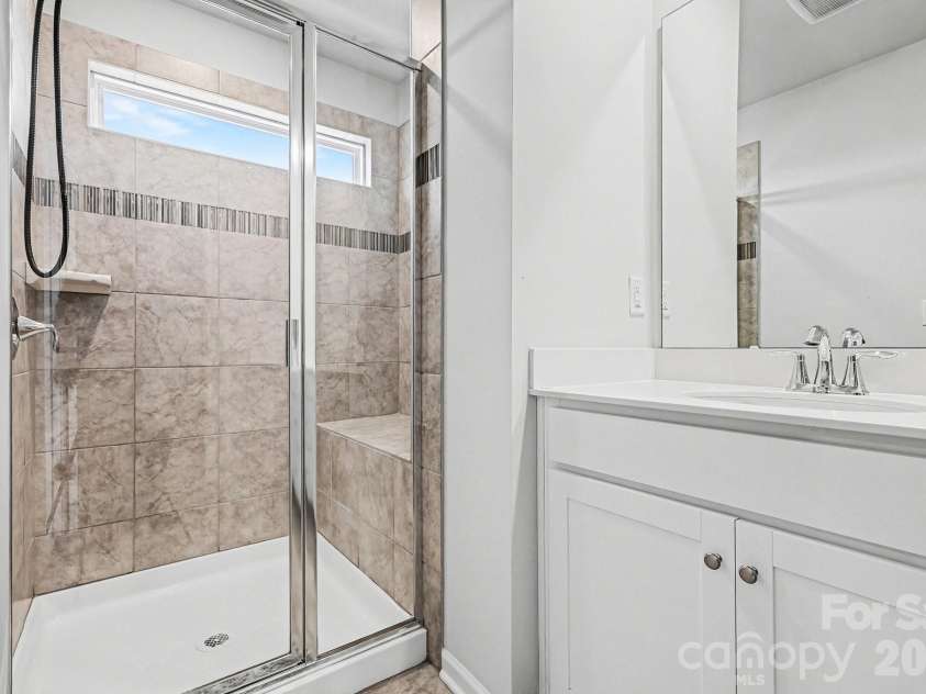 117 Morning Gap Parkway, Fort Mill, SC 29715.  MLS# CAR4333429, YatesRealty ID 4918. Primary bathroom tile step in shower. 