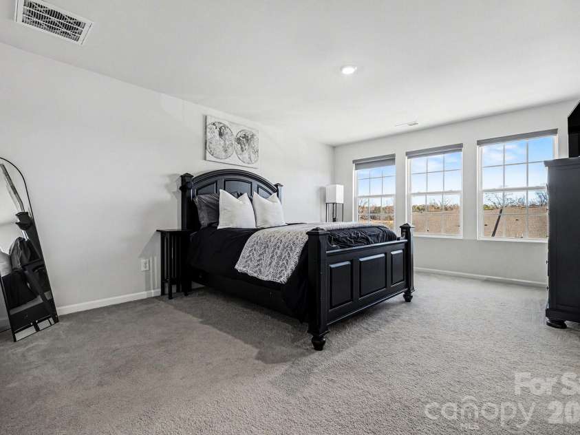 117 Morning Gap Parkway, Fort Mill, SC 29715.  MLS# CAR4333429, YatesRealty ID 4918. View of primary bedroom from the closet view.