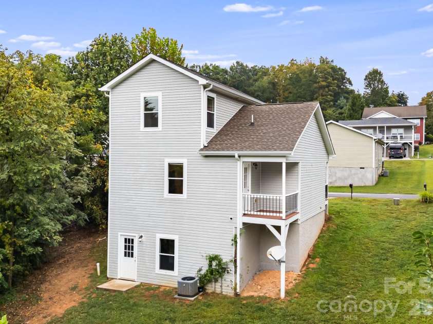 1 Red Clover Drive, Candler, NC 28715.  MLS# CAR4305641, YatesRealty ID 4919. Back of Home
