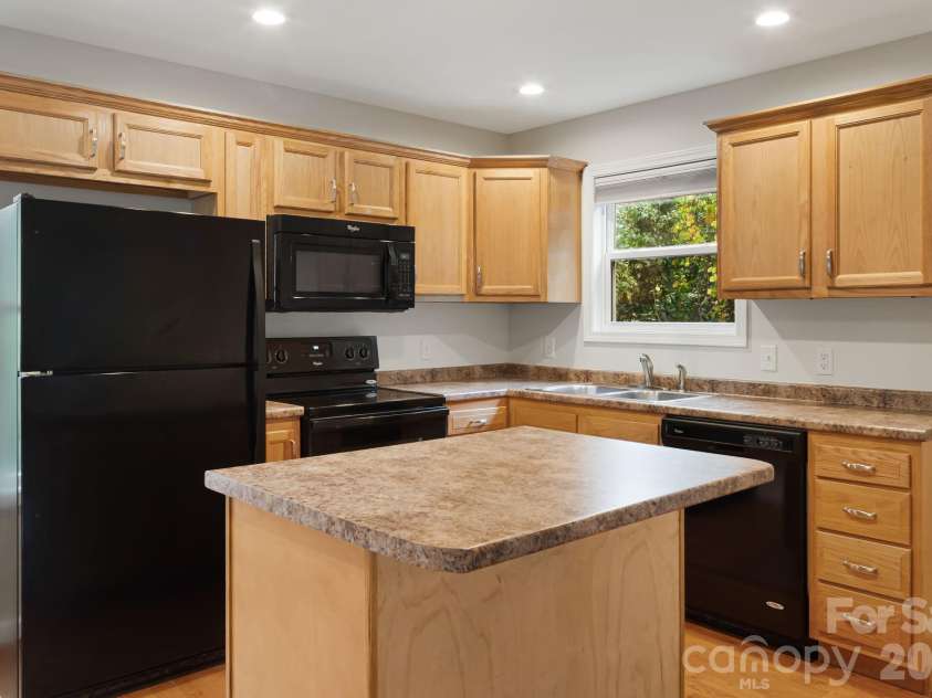 1 Red Clover Drive, Candler, NC 28715.  MLS# CAR4305641, YatesRealty ID 4919. Kitchen featuring island