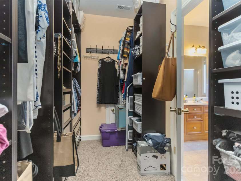 1608 Copperplate Road, Charlotte, NC 28262.  MLS# CAR4323232, YatesRealty ID 492. Owner's walk-in closet custom shelving