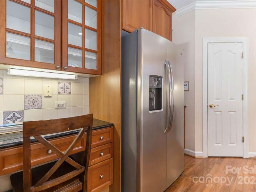 1608 Copperplate Road, Charlotte, NC 28262.  MLS# CAR4323232, YatesRealty ID 492. Stainless steel fridge/bar area