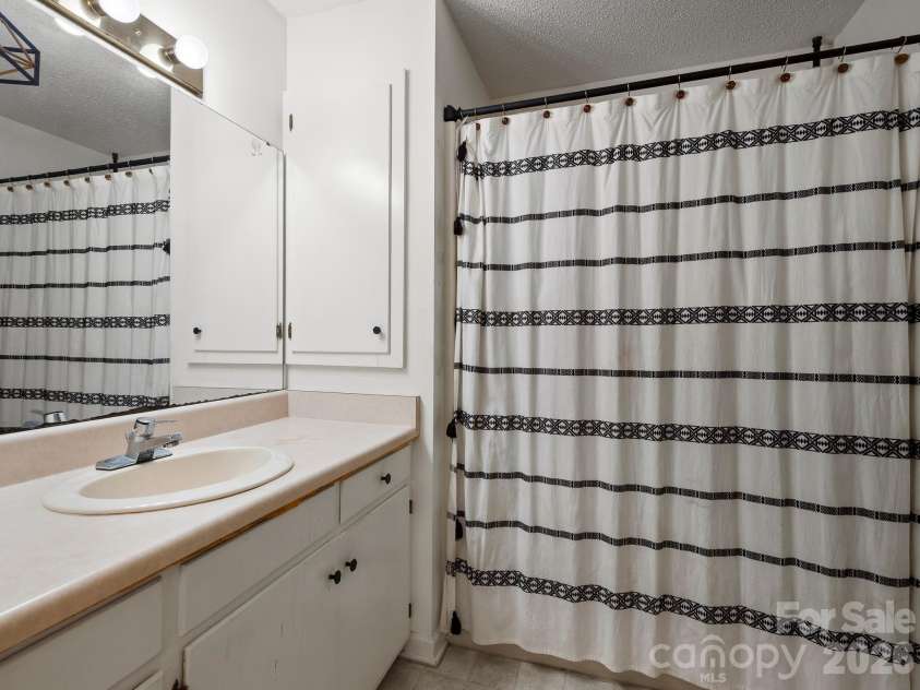 689 Trade Street, Tryon, NC 28782.  MLS# CAR4421132, YatesRealty ID 49209. Primary bathroom ensuite