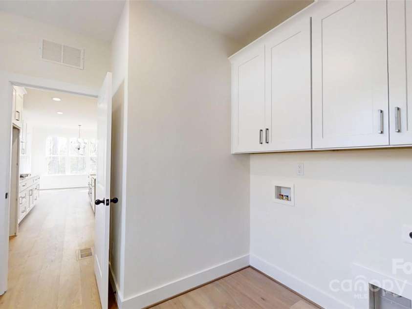 472 Bellingshire Drive, Mt Ulla, NC 28125.  MLS# CAR4292714, YatesRealty ID 4922. Laundry and drop zone off kitchen.