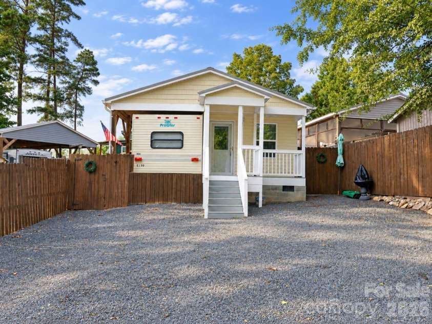 309 Lake Tillery Trail, Mount Gilead, NC 27306.  MLS# CAR4422182, YatesRealty ID 49233. 