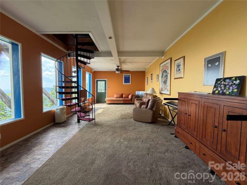484 Alpine Drive, Little Switzerland, NC 28749.  MLS# CAR4415396, YatesRealty ID 49237. Lower floor living/primary bed