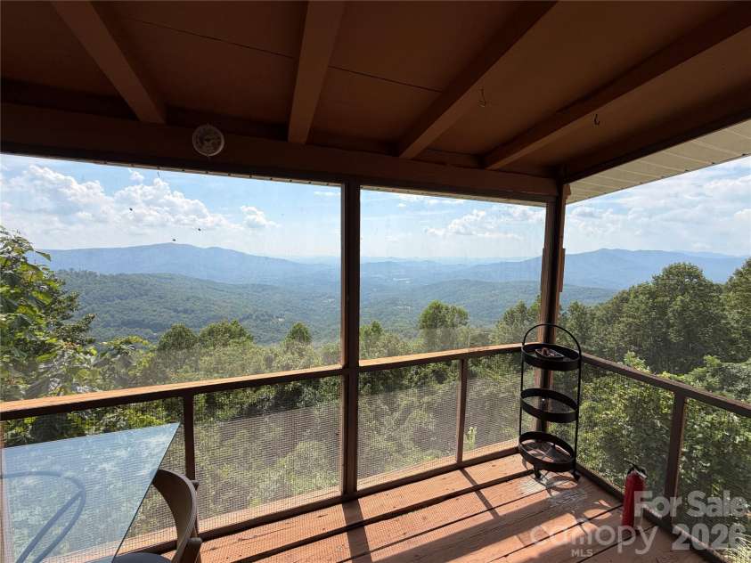 484 Alpine Drive, Little Switzerland, NC 28749.  MLS# CAR4415396, YatesRealty ID 49237. Screened deck main floor