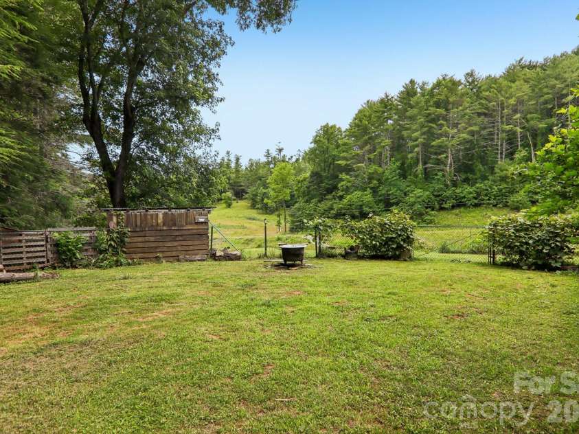 164 Pegg Road, Marshall, NC 28753.  MLS# CAR4417491, YatesRealty ID 49238. Fenced in side yard.