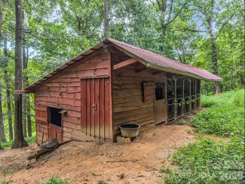 136 Limousine Lane, Pisgah Forest, NC 28768.  MLS# CAR4416612, YatesRealty ID 49241. 5 Stall goat barn