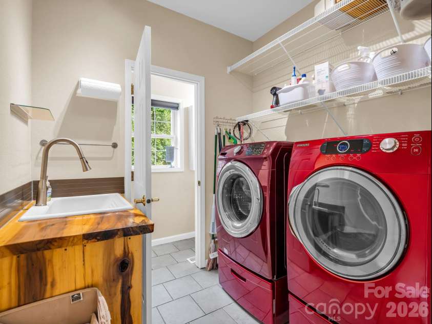 136 Limousine Lane, Pisgah Forest, NC 28768.  MLS# CAR4416612, YatesRealty ID 49241. Laundry and mud room along with a half bath