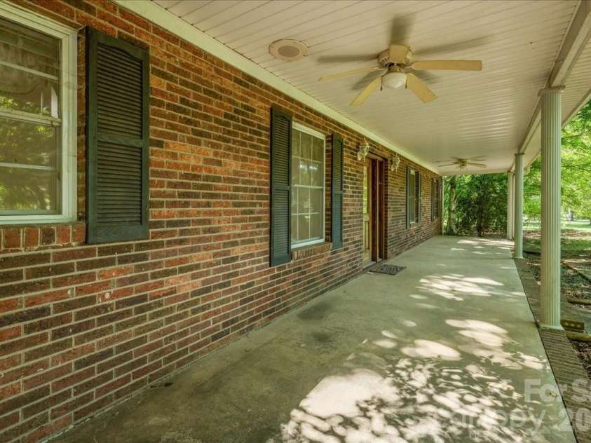 6712 Mexico Road, Concord, NC 28025.  MLS# CAR4400821, YatesRealty ID 49257. Front porch and front door.