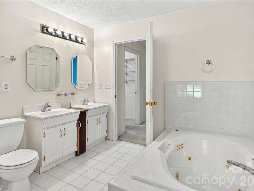6712 Mexico Road, Concord, NC 28025.  MLS# CAR4400821, YatesRealty ID 49257. Jacuzzi in primary bathroom.