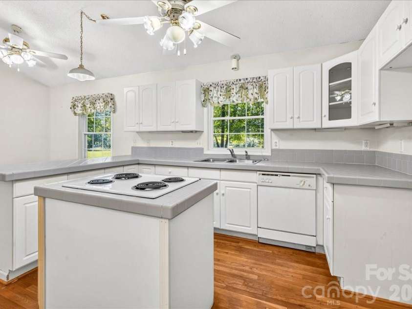 6712 Mexico Road, Concord, NC 28025.  MLS# CAR4400821, YatesRealty ID 49257. Kitchen with island and window.