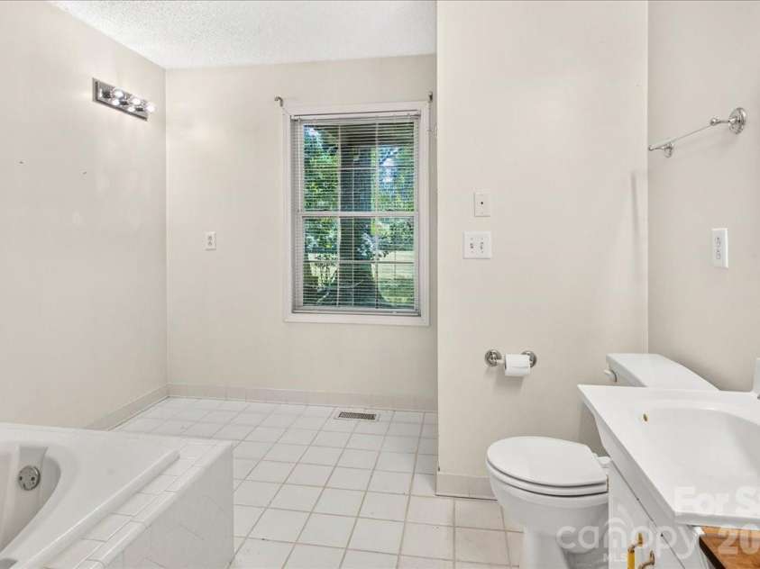 6712 Mexico Road, Concord, NC 28025.  MLS# CAR4400821, YatesRealty ID 49257. Primary bathroom.