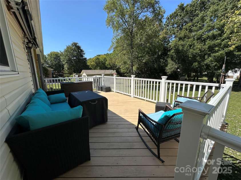 818 Rubens Road, Concord, NC 28027.  MLS# CAR4309635, YatesRealty ID 4926. HUGE Custom Deck Great for Family Times 