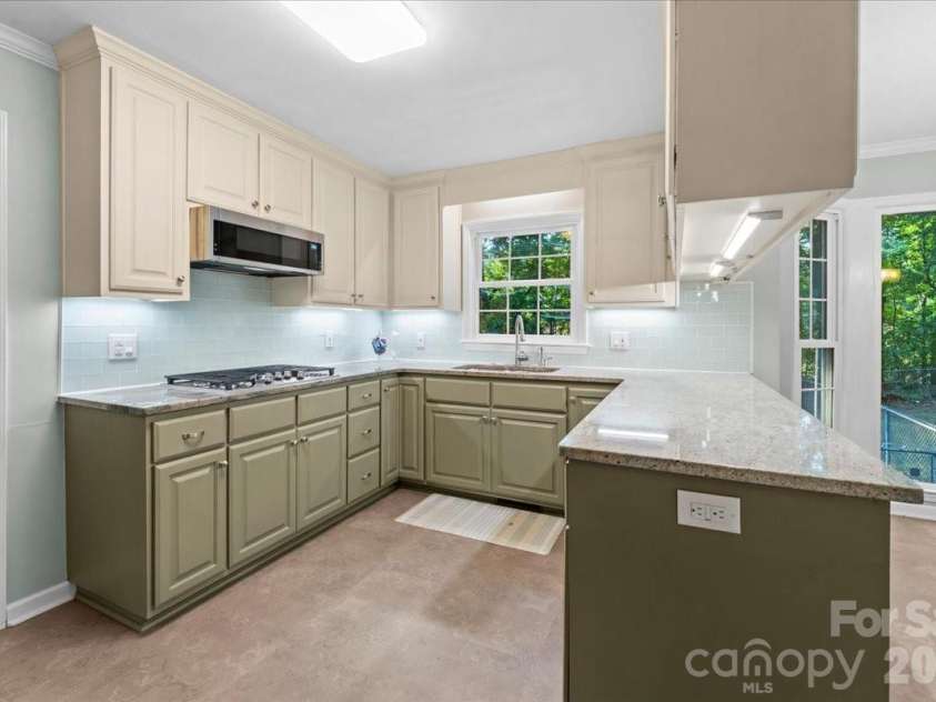 705 Brunson Drive, Albemarle, NC 28001.  MLS# CAR4422232, YatesRealty ID 49272. Newly painted kitchen with new appliances.