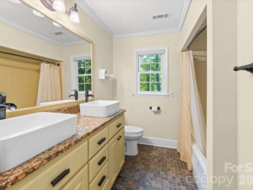 705 Brunson Drive, Albemarle, NC 28001.  MLS# CAR4422232, YatesRealty ID 49272. Upstairs Hall Bathroom