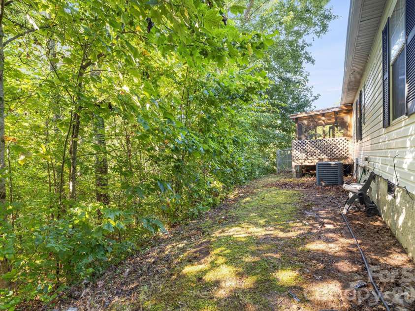 96 Fallswood Court, Hendersonville, NC 28739.  MLS# CAR4422218, YatesRealty ID 49273. Left side backyard.