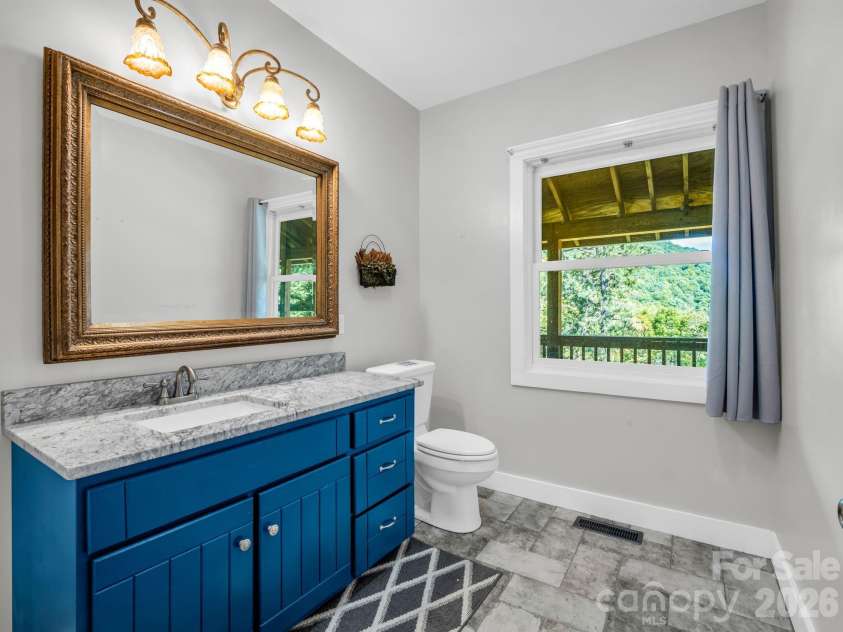 119 Mountain Bluff Trail, Hendersonville, NC 28792.  MLS# CAR4422233, YatesRealty ID 49280. Main level powder bath