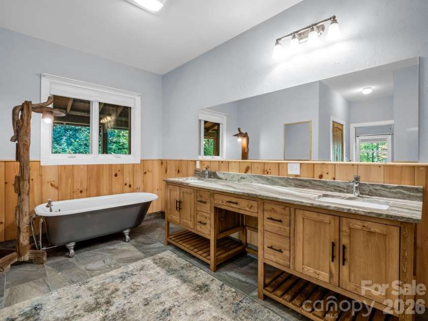 119 Mountain Bluff Trail, Hendersonville, NC 28792.  MLS# CAR4422233, YatesRealty ID 49280. Primary en suite bath with clawfoot soaking tub & double vanity