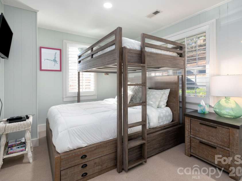 183 Blarney Road, Lake Lure, NC 28746.  MLS# CAR4326369, YatesRealty ID 49285. Bedroom One has Queen bed and double bed bunk bed combo.