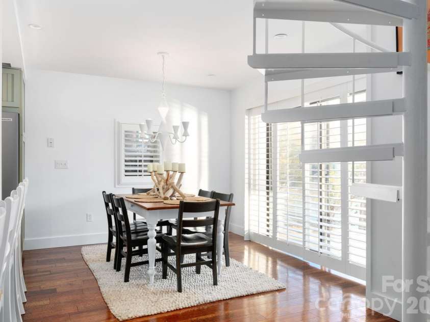 183 Blarney Road, Lake Lure, NC 28746.  MLS# CAR4326369, YatesRealty ID 49285. Decorative spiral staircase down to the lower level