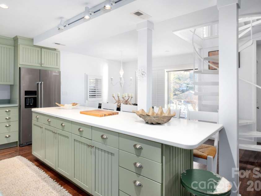 183 Blarney Road, Lake Lure, NC 28746.  MLS# CAR4326369, YatesRealty ID 49285. Gigantic chef’s kitchen with island with breakfast seating