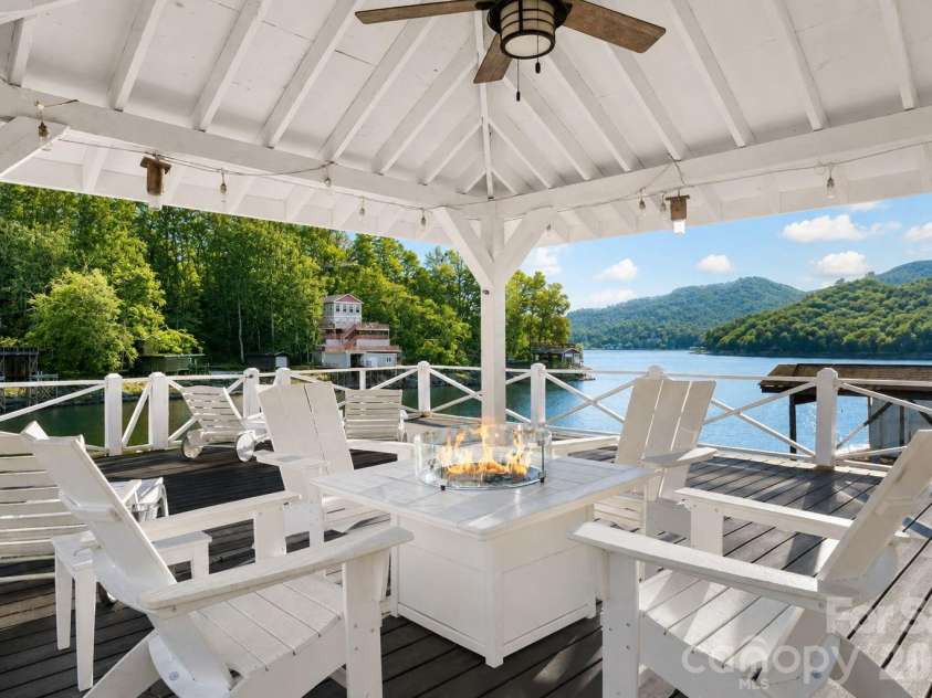 183 Blarney Road, Lake Lure, NC 28746.  MLS# CAR4326369, YatesRealty ID 49285. Huge entertaining area above boathouse great for grilling, parties, firepit.