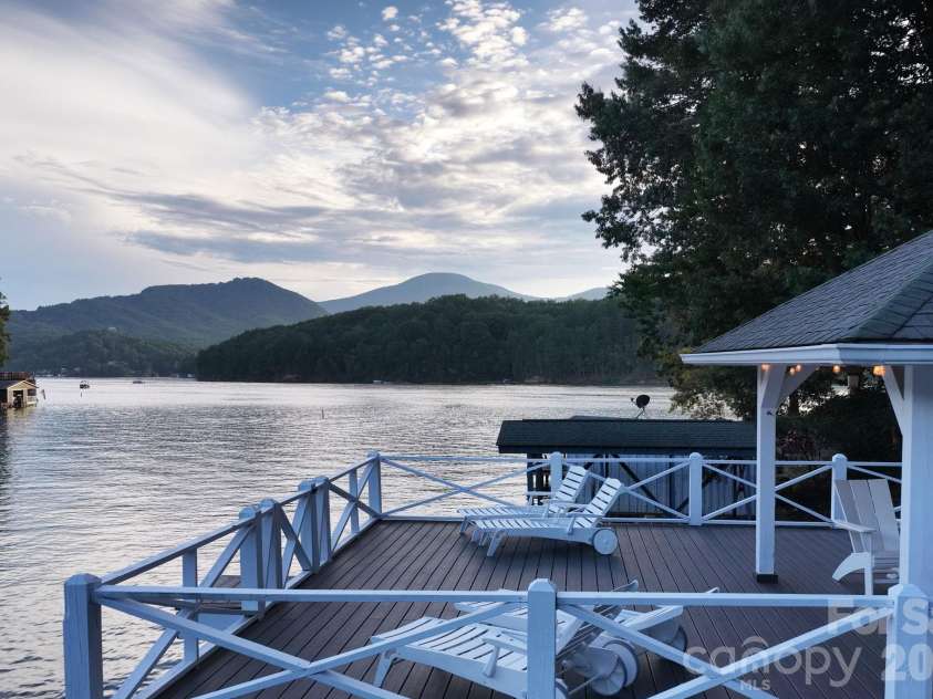 183 Blarney Road, Lake Lure, NC 28746.  MLS# CAR4326369, YatesRealty ID 49285. Property includes an expansive party deck, a private high dive, a covered gazebo.