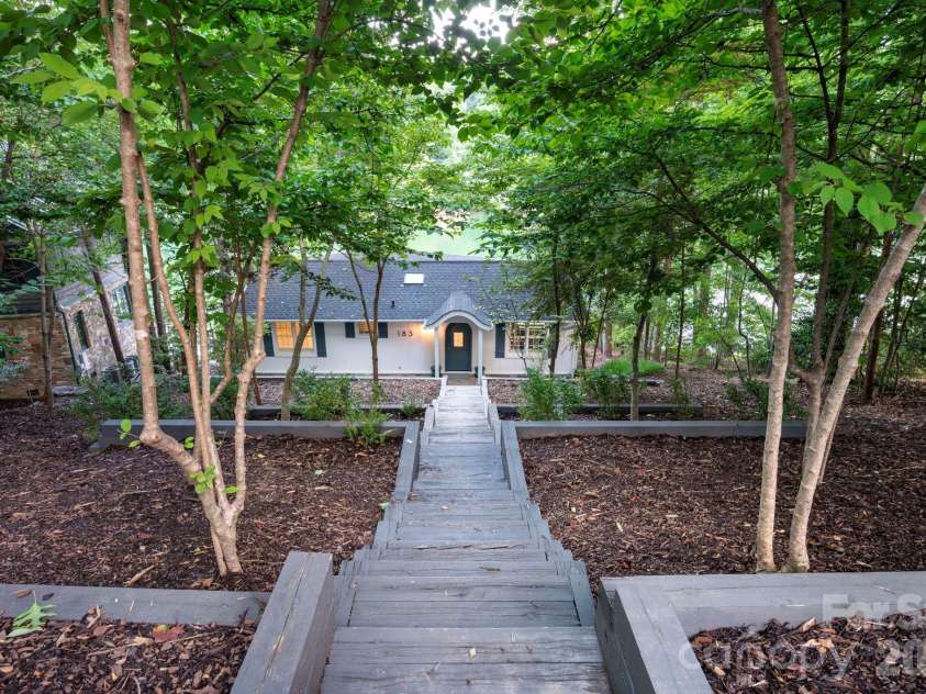 183 Blarney Road, Lake Lure, NC 28746.  MLS# CAR4326369, YatesRealty ID 49285. Terraced garden beds at entry