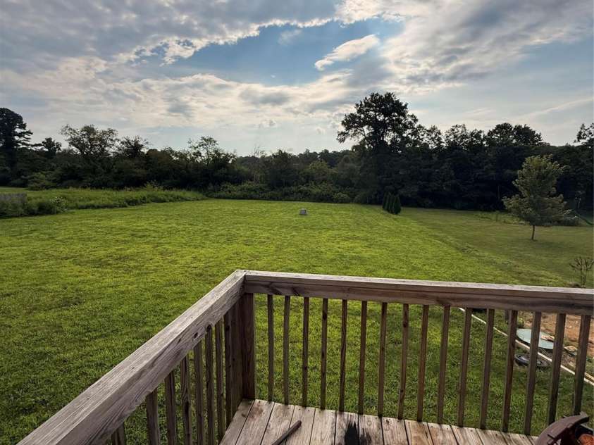 37 Mossy Brook Trail, Hendersonville, NC 28792.  MLS# CAR4418383, YatesRealty ID 49287. Back Porch and yard