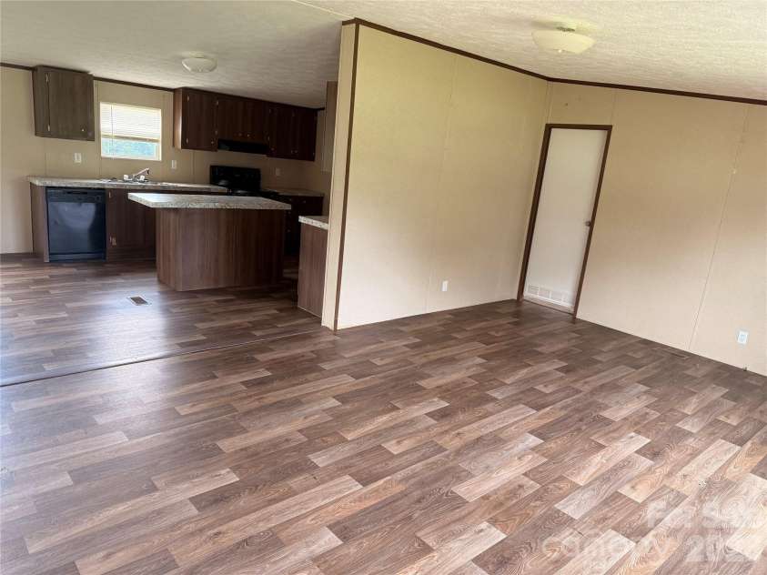 37 Mossy Brook Trail, Hendersonville, NC 28792.  MLS# CAR4418383, YatesRealty ID 49287. Living room and Kitchen