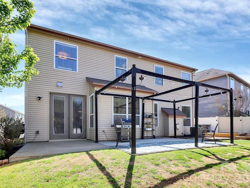 5519 Hubbard Point Drive, Charlotte, NC 28269.  MLS# CAR4419851, YatesRealty ID 49289. Extended Patio w framed Arbor like Structure