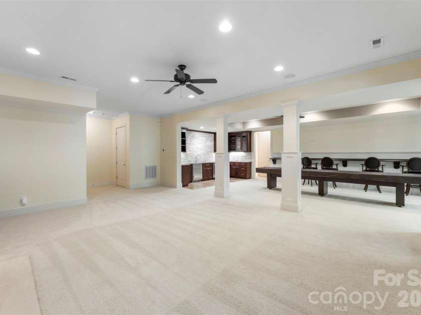 8928 Heydon Hall Circle, Charlotte, NC 28210.  MLS# CAR4297775, YatesRealty ID 49323. Fully finished basement with bedroom, full bath and extra storage