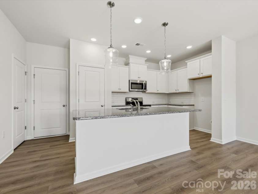 6617 Fire Lily Lane, Charlotte, NC 28216.  MLS# CAR4422331, YatesRealty ID 49324. Kitchen with Large Island