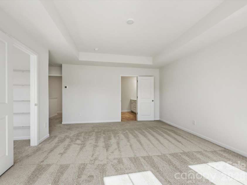 6617 Fire Lily Lane, Charlotte, NC 28216.  MLS# CAR4422331, YatesRealty ID 49324. Oversized Owner Suite with Tray Ceiling