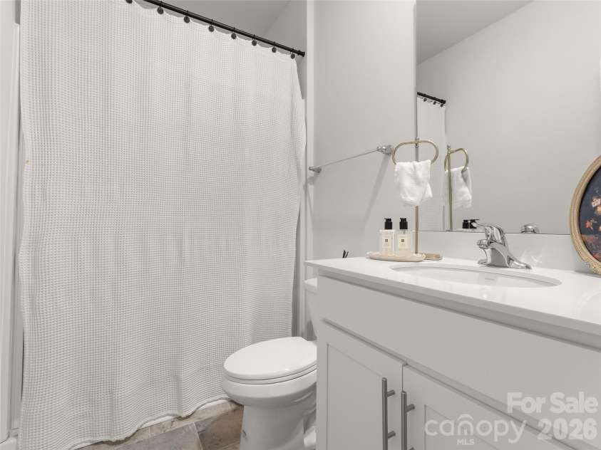 302 woodnettle Lane, Arden, NC 28704.  MLS# CAR4421462, YatesRealty ID 49330. Downstairs bathroom