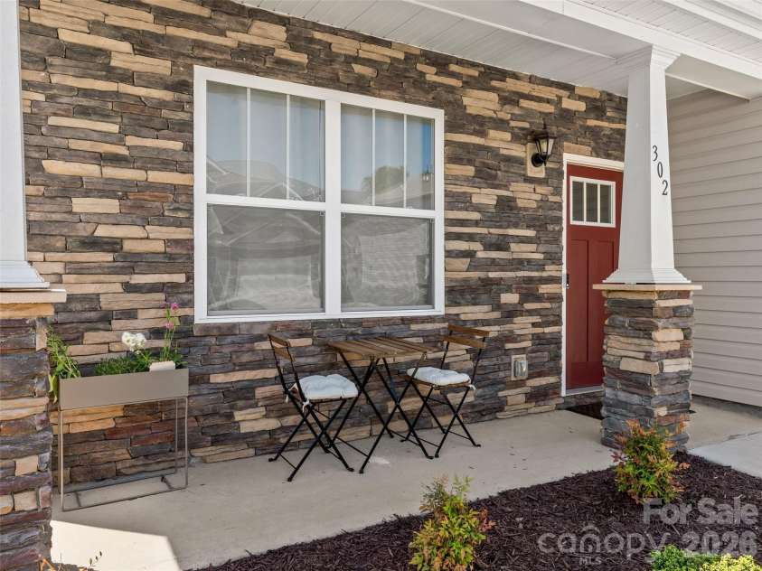 302 woodnettle Lane, Arden, NC 28704.  MLS# CAR4421462, YatesRealty ID 49330. Front porch