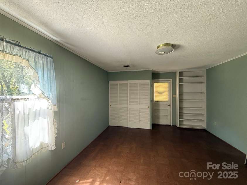 516 Averys Creek Road, Arden, NC 28704.  MLS# CAR4300321, YatesRealty ID 4935.    Lower level Bedroom