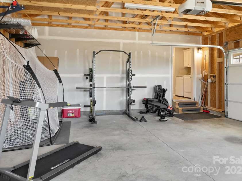 52 Stone Ridge Trail, Mills River, NC 28759.  MLS# CAR4239861, YatesRealty ID 4935. 2 car garage currently used for parking & gym