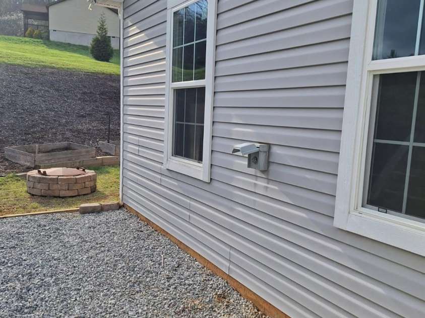 52 Stone Ridge Trail, Mills River, NC 28759.  MLS# CAR4239861, YatesRealty ID 4935. EV charger on the side of the house